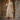 Woman wearing 1940s Lumber Jill check day dress in caramel brown plaid against wooden door