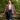 Model wearing unbuttoned 1940s style red shadow plaid Downtime worker jacket with dark blue jeans