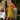 Woman in 1940s style mustard yellow and pink floral tea dress with pink cardigan standing by vintage tent