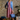 Blonde woman posing in Bonbon blue Daydream cardigan over pink floral dress