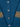 Close-up detail of neptune blue Scottish wool cardigan showing mother-of-pearl button placket and ribbed cuffs with mustard yellow trim