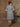 Rear view of redhead model wearing 1950s geometric stripe cotton midi dress in studio