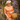 Blonde woman in orange gingham 1940s skirt suit, straw hat, and wicker bag