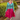 Blonde woman posing outdoors in Jitterbug teal green Daydream cardigan over red dress